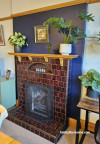 Fireplace, brick fireplace with dark blue wall, fireplace with wall in Resene Blue Night