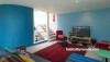 family room, lounge, living room, blue lounge, blue and red, colourful living room